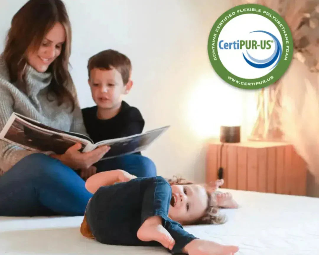 Mother reading to her children on a CertiPUR-US® certified mattress, promoting safe and comfortable family sleep.