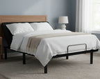 Bed with white bedding and a wooden headboard in a bedroom setting.