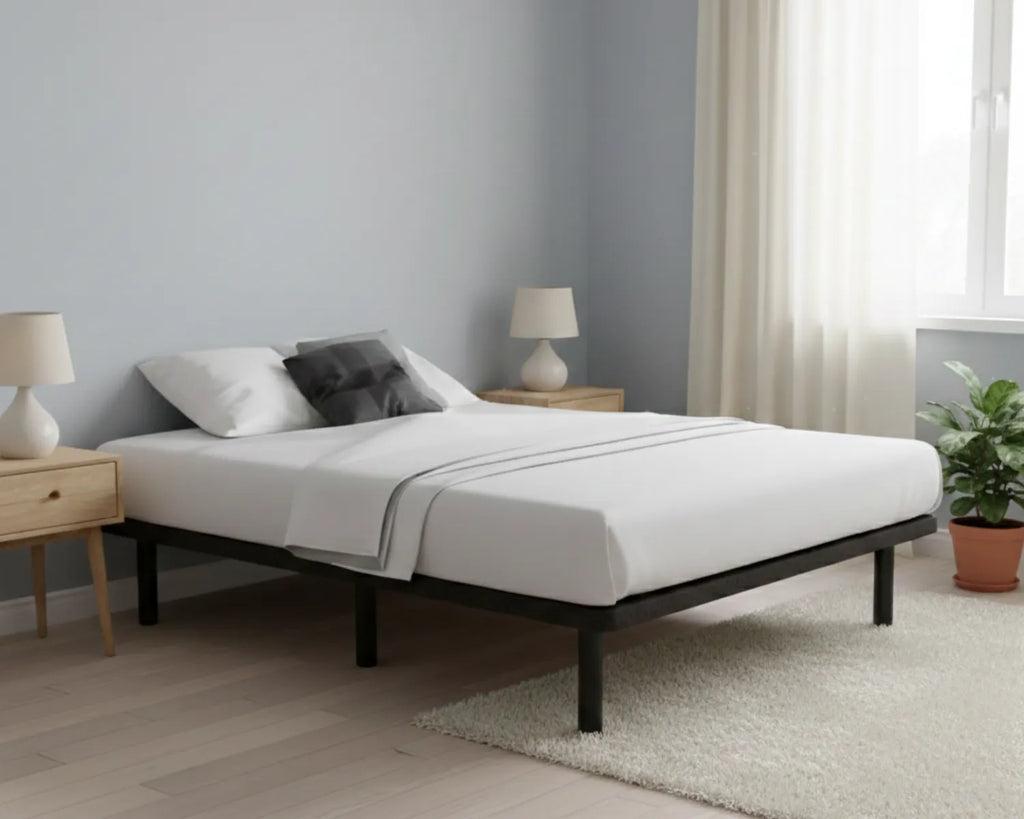 Bedroom with a bed, nightstands, and lamps in a minimalistic setting.