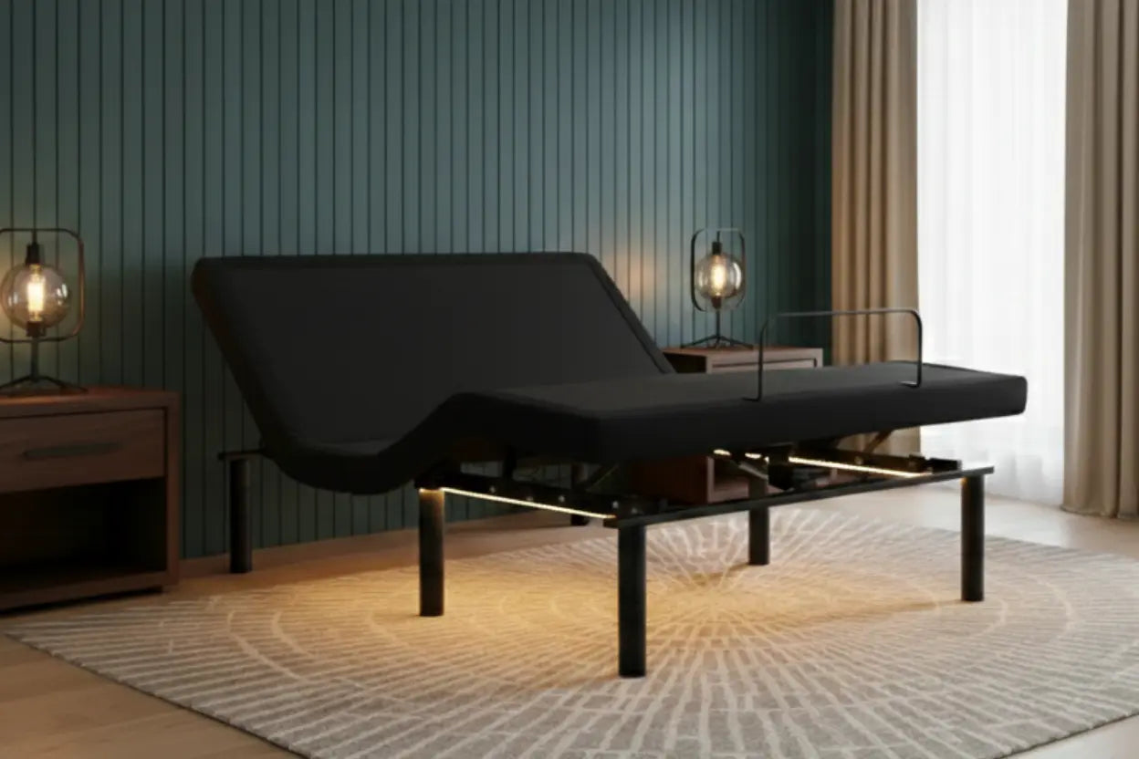 Modern black adjustable bed in a room with green walls and a window.