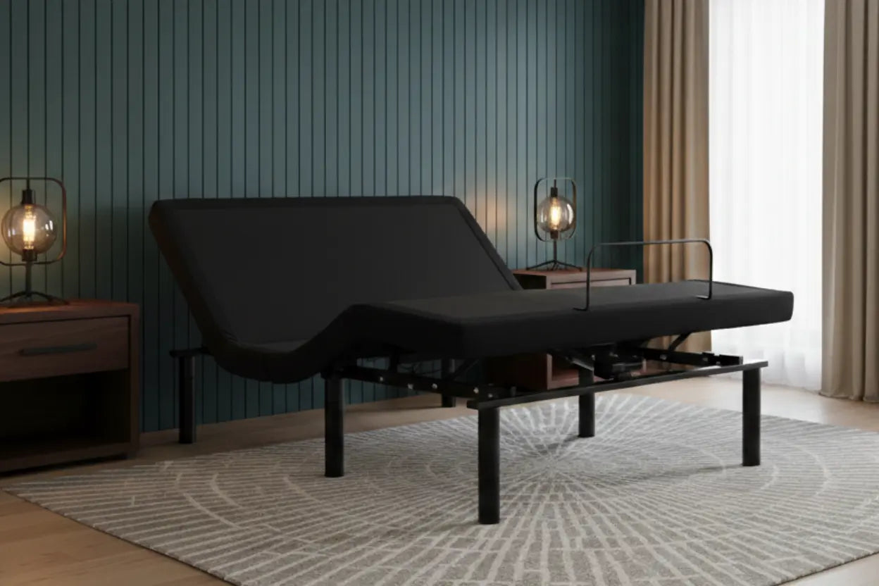 Black adjustable bed in a bedroom setting with wooden nightstands and lamps.