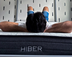 Man laying on HIBER mattress.