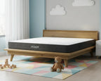 Hiber mattress on a wooden bed frame in a child's room with toys and a teddy bear.