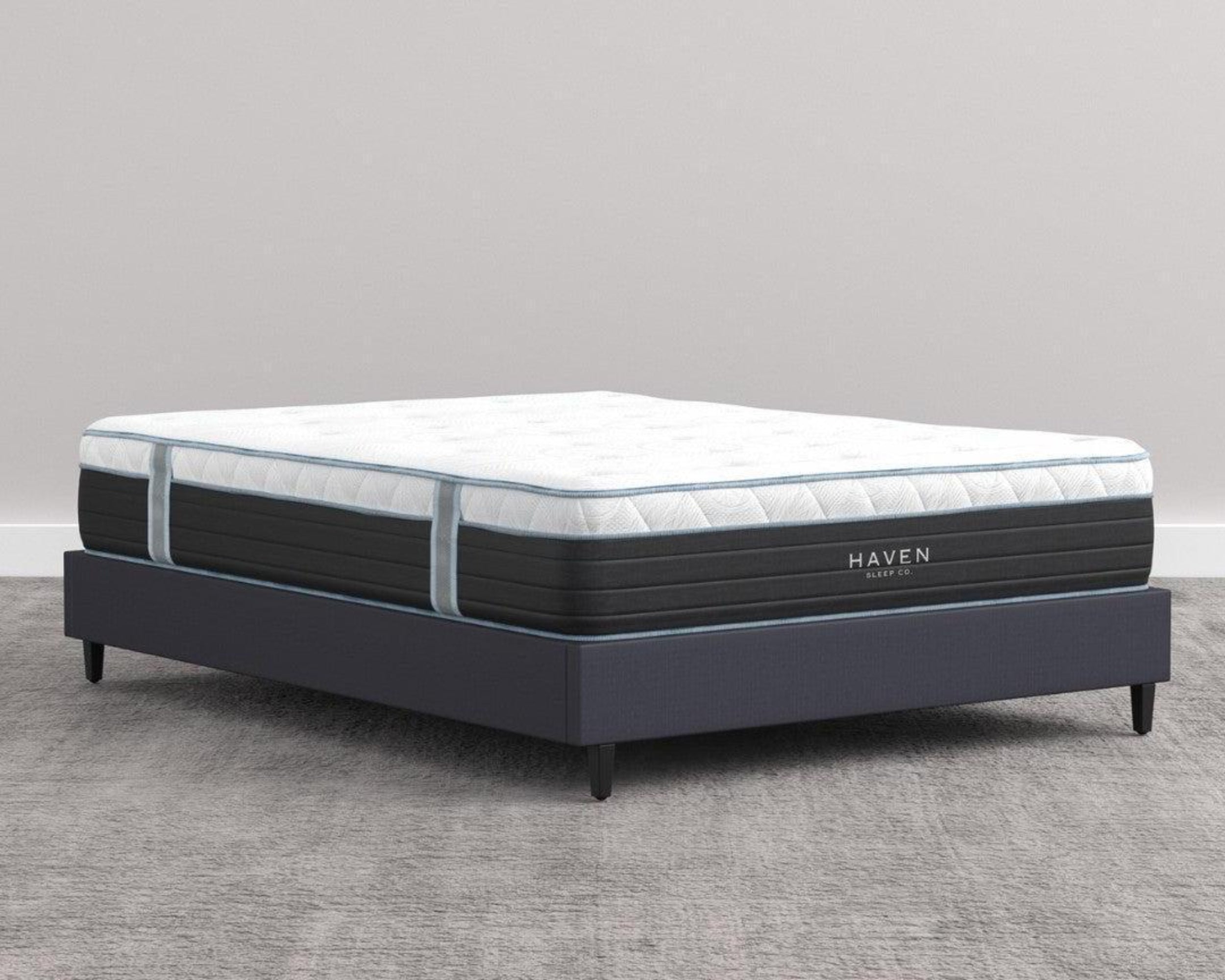 Angled View of Haven Hybrid Mattress on a Low Bed Frame in a Minimalist Bedroom