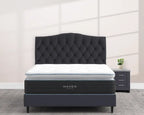 Haven LUX Pillowtop Hybrid Mattress with 14-inch profile, elegantly displayed on a modern upholstered bed with tufted headboard.