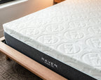 Mattress with Haven Sleep Co. branding on a wooden bed frame.