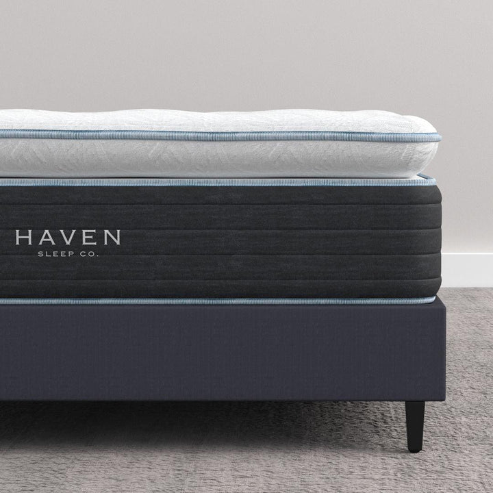 Close-up of Haven LUX Pillowtop Hybrid mattress, highlighting the 14-inch height and plush pillowtop layer for luxurious support and comfort, with the Haven Sleep Co. branding.