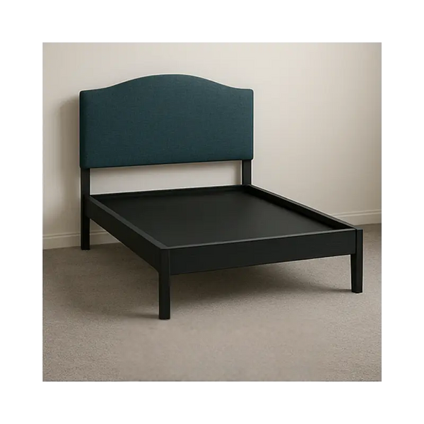 Black platform bed frame with navy blue headboard. 