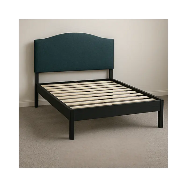 Slatted bed frame with navy blue headboard. 