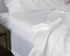 Upclose shot of silky white sheets by Bedface