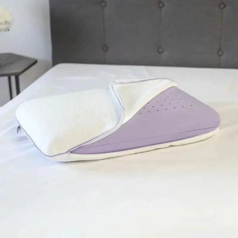 Side view of a Lavender Infused Gel Foam Pillow with a plush, ergonomic design, featuring a cool and cozy cover partially peeled back to reveal the ventilated lavender-infused gel foam, designed for ultimate comfort and temperature regulation.