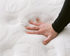 Hand pressing Haven pocket coil mattress