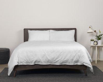 showcase of Bedface 100% Cotton Percale European bundle collection with Sheet set and Duvet cover in starlight white on a Haven mattress Bed-in-box on a dark brown bed frame 